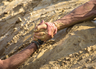 Helping hands in mud