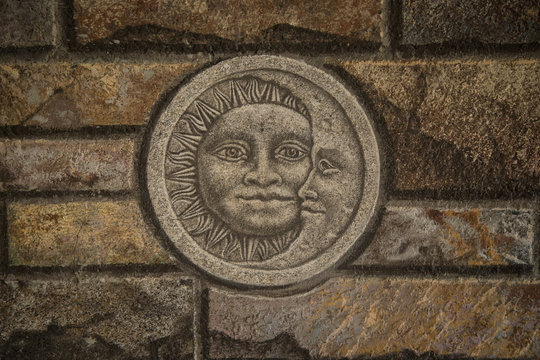 Brick wall with sun and moon motif