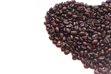 Roasted coffee beans in half heart shape on white background, isolated picture