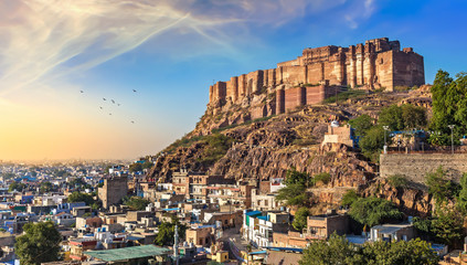 Mehrangarh Fort at sunset with view of Jodhpur cityscape.