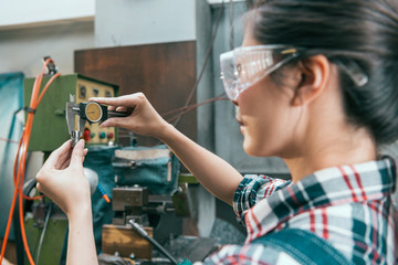 milling machine factory manager using caliper