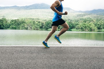 man runner jogger running at lake view in the morning