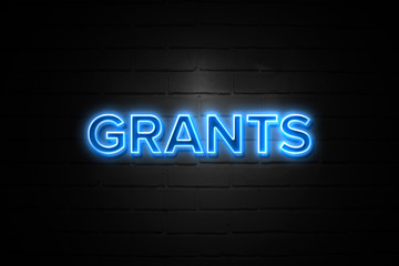 Grants neon Sign on brickwall