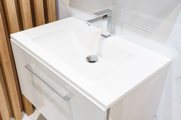Interior of bathroom with sink basin faucet and mirror. Modern design of bathroom