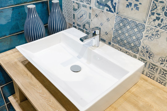 Interior of bathroom with sink basin faucet and mirror. Modern design of bathroom - Powered by Adobe