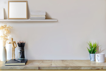 Mockup modern home decor poster with dummy, houseplant. Artist workspace with copy space for products display montage.