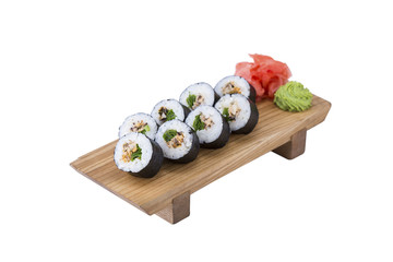 Sushi set on a wooden board, isolated.