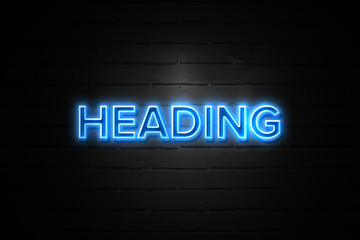 Heading neon Sign on brickwall