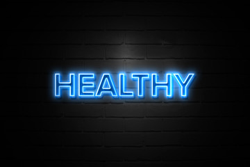 Fototapeta premium Healthy neon Sign on brickwall