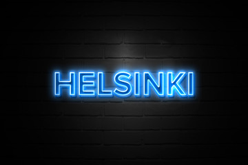 Helsinki neon Sign on brickwall