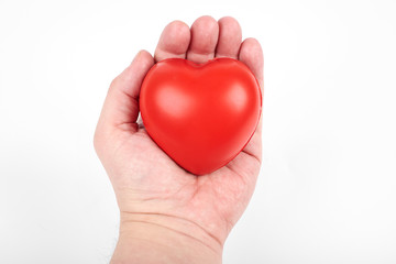 Heart in a hand, isolated on a white background. Gift for St. Valentine's Day