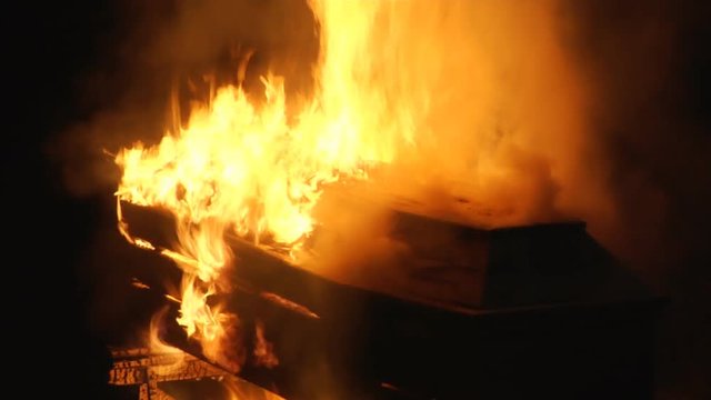 Coffin burns at night