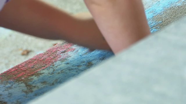 Child Coloring with Blue Chalk on Sidewalk Close Up, 4K