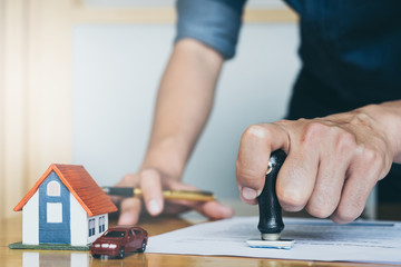 Image of Man's notary public hand stamping the document. business man, law attorney, lawyer notary...
