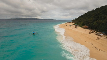 Aerial view of beautiful tropical island with white sand beach, hotels and tourists, Boracay, Puka...