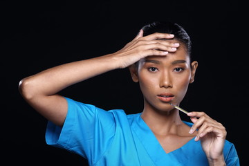 Obraz premium Doctor Nurse in white blue shirt with syringe