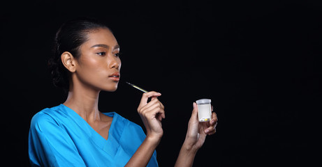 Obraz premium Doctor Nurse in white blue shirt with syringe