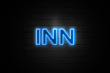 Inn neon Sign on brickwall