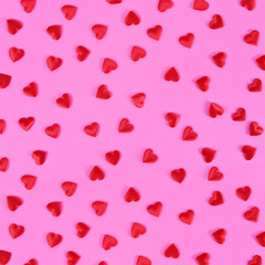 Red hearts on pink background.