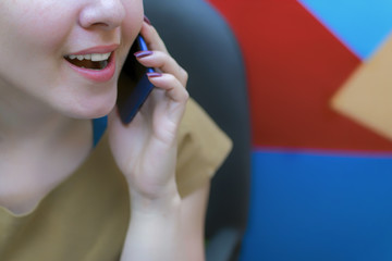 A young girl in the workplace. Working process. Decorator.