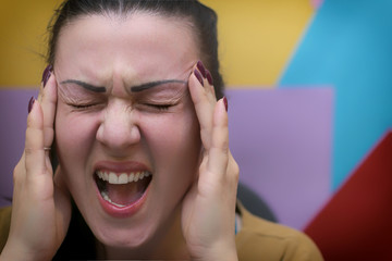 Girl holding her head. Headache. Work. Stress.