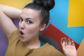 A young girl in the workplace. Working process. Decorator.