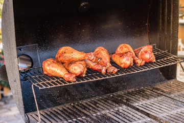 grilled chicken legs prepared outdoors