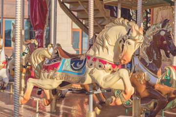 Fototapeta na wymiar Horses on a carnival Merry-Go-Round. toned