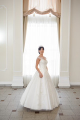Fototapeta premium Beautiful bride in wedding dress