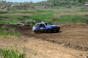 Race of the old wrecked cars. Rally on the open air with dust