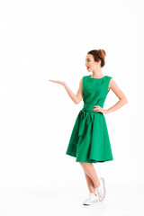 Fototapeta premium Full length portrait of a cheerful young girl