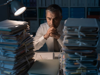Business executive overloaded with work