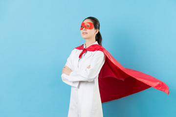 confident woman doctor wearing superhero clothing
