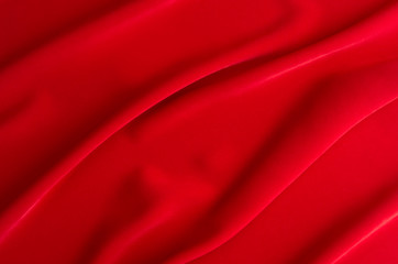 Naklejka na ściany i meble Red silk wavy background. Passion backdrop for Valentines day.
