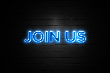 Join Us neon Sign on brickwall