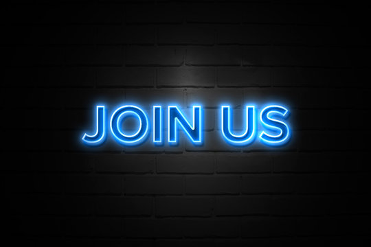 Join Us neon Sign on brickwall
