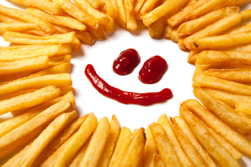 French fries  and a face with a smile from ketchup isolated on white background