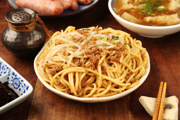 Chinese fried noodle on the wooden table