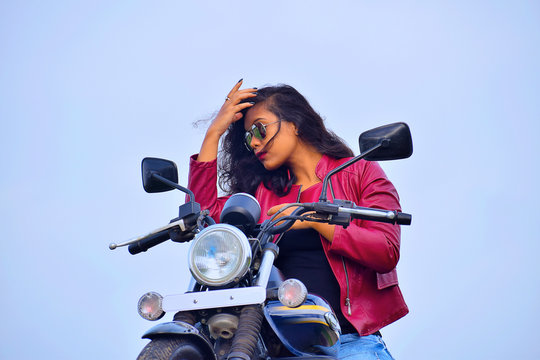 Free Photo | Pensive female driver in stylish clothes, poses on fast  motorbike, looks thoughtfully aside