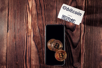 Bitcoin golden coins and paper receipt