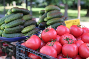 Local Farmers Market. Fresh produce: vegetables, berries, wild flowers. Older people buying groceries. Lithuania.