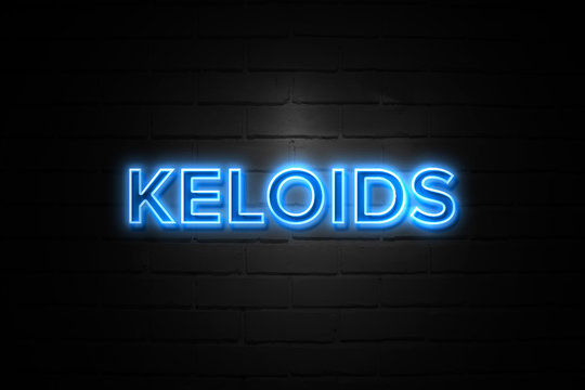 Keloids neon Sign on brickwall