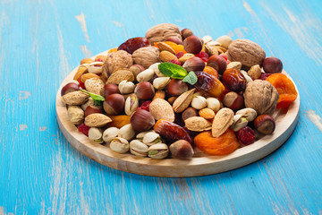 Naklejka na ściany i meble Assortment of dry fruits and nuts