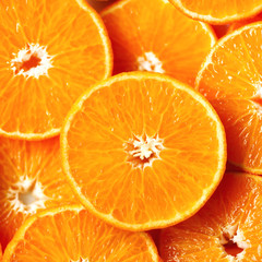 Fresh sliced orange fruit texture. Macro, top view, copy space. Food frame. Juicy oranges background