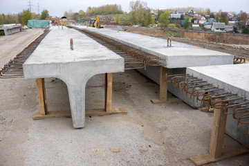 Structural beams and columns of the construction of a new concrete bridge in the rural areas.
