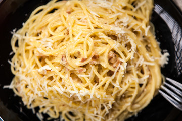 Spaghetti carbonara with egg and pancetta