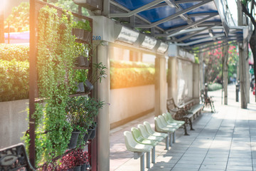 Blurred bus station in Thailand with sunset.