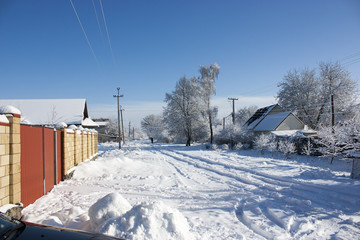 Winter street in the snow, a sunny winter day, at home