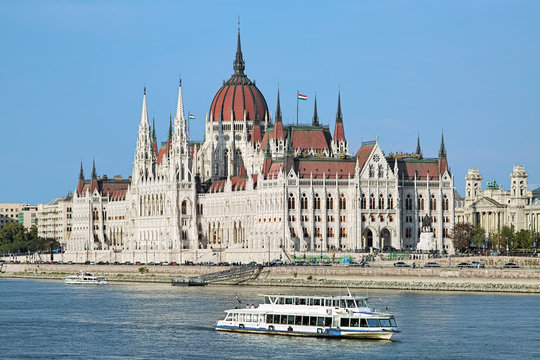 The Hungarian Parliament Building and sightseeing ships on the Danube in Budapest, Hungary