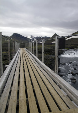 Wooden bridge over a mountain river in Iceland